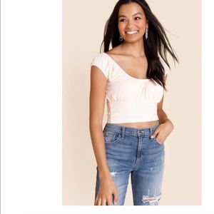 Francesca’s light pink ruched cropped shirt size M NWOT